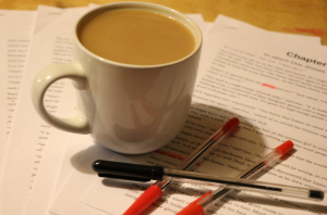 tea cup and pens